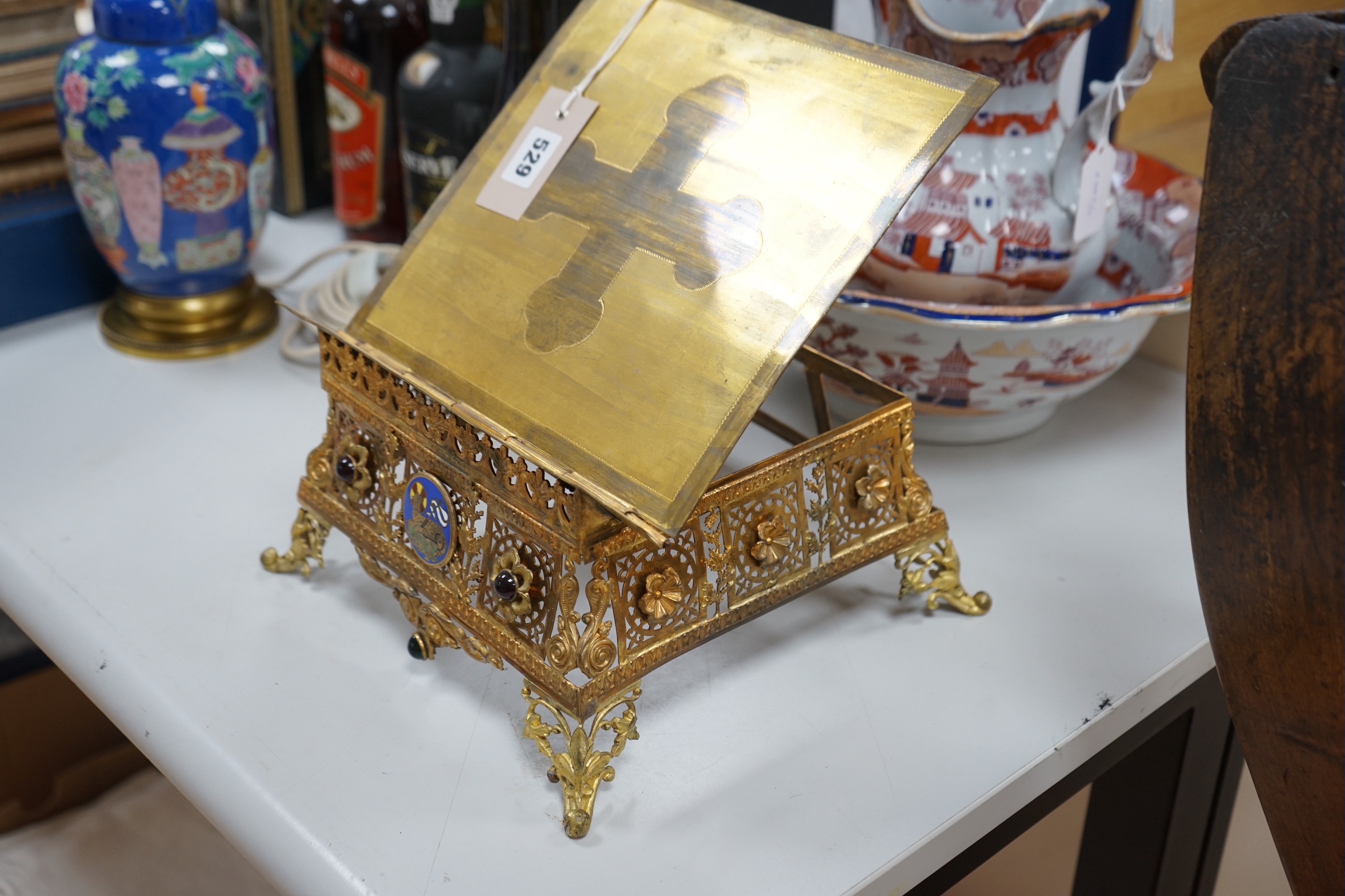 A gilt brass bible stand